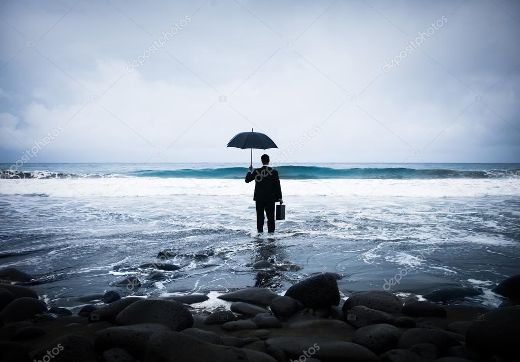 Lonely Businessman Alone in Beach