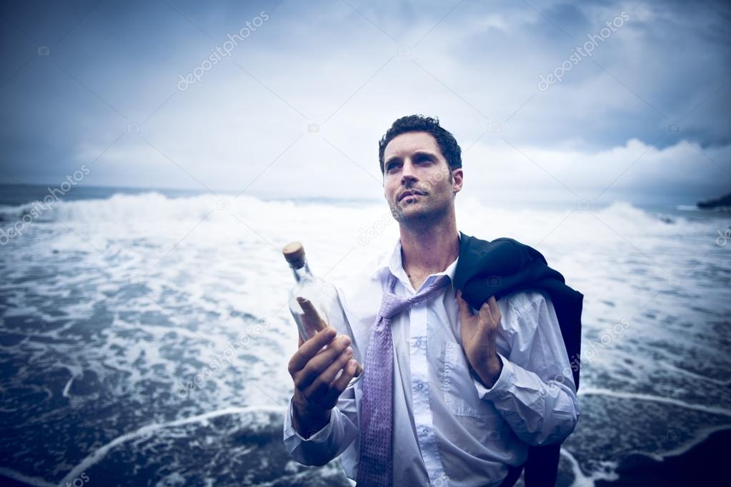 Businessman with Message in Bottle