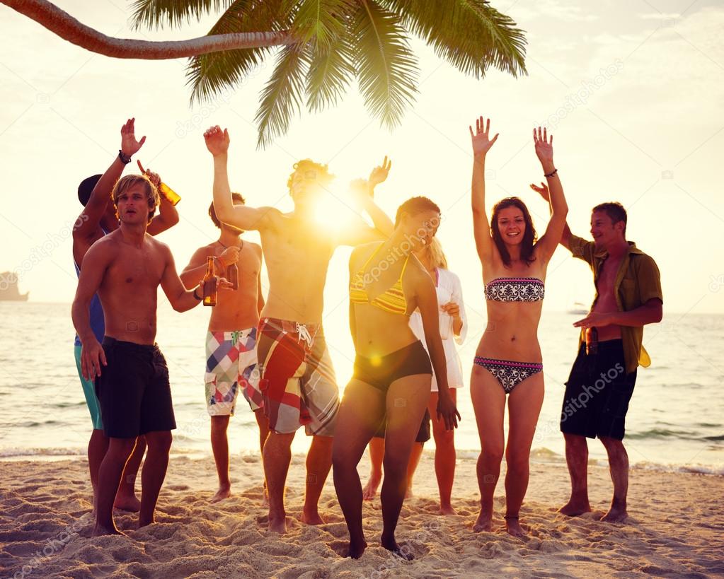 People Dancing and Partying on a Tropical Beach