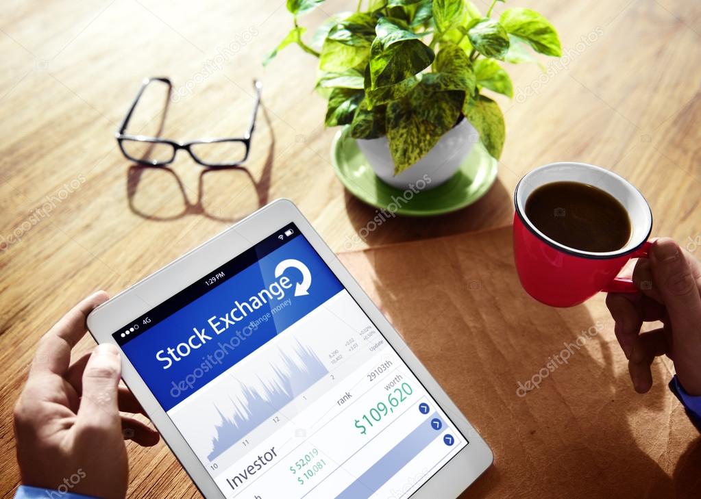 Hands holding tablet with Stock Exchange