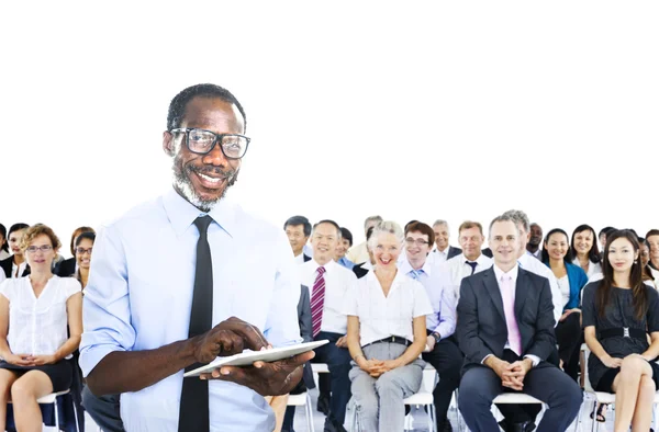 African Businessman in Front of Crowd — Stock Photo, Image