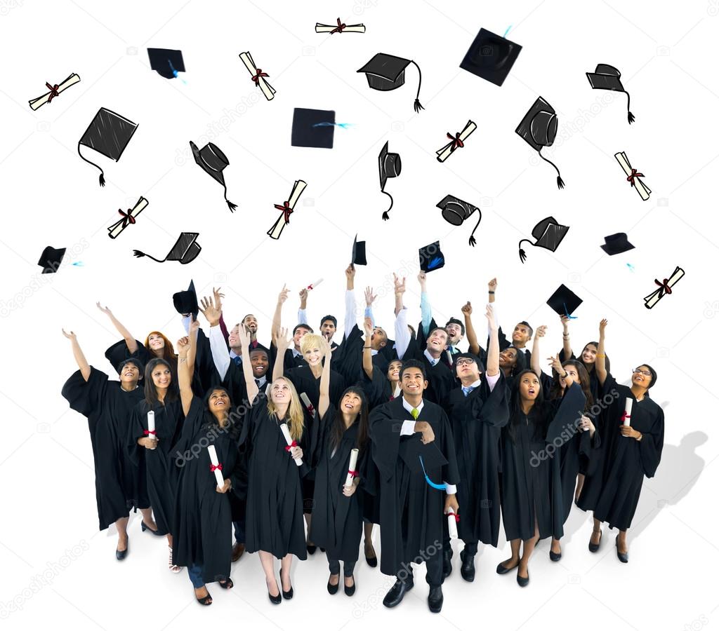 Graduates throwing graducation caps