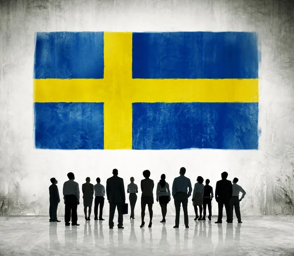 Swedish flag and business people — Stock Photo, Image