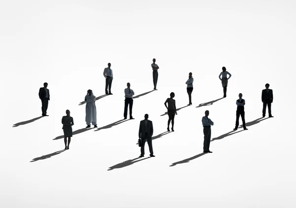 Silhouettes of business people standing — Stock Photo, Image