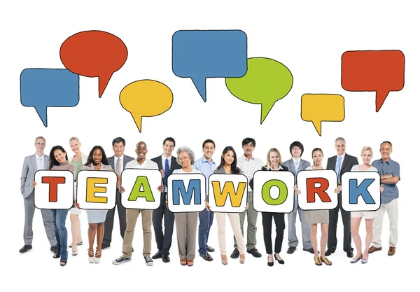 Business people holding word teamwork — Stock Photo, Image