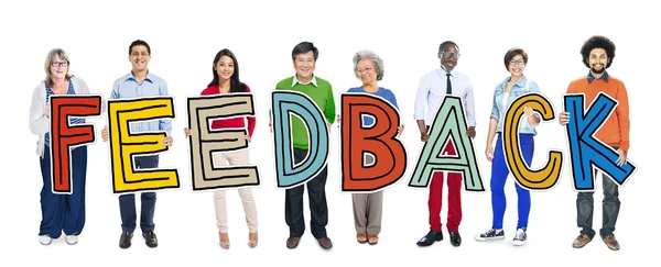 People Standing Holding word Feedback — Stock Photo, Image