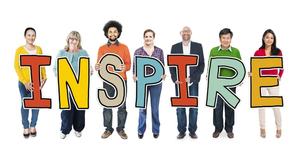 People Holding word Inspire — Stock Photo, Image