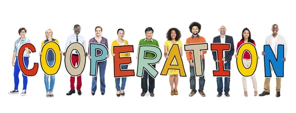 People Holding word Cooperation — Stock Photo, Image