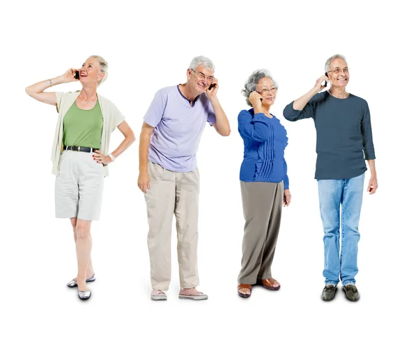 Senior adult using communication devices — Stock Photo, Image