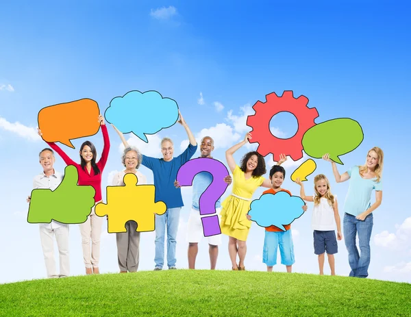 People Holding Speech Bubbles and Symbols — Stock Photo, Image