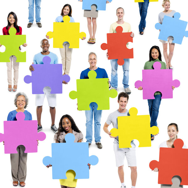People holding Jigsaw Pieces