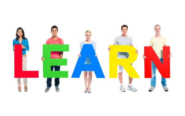 People Holding word 'Learn' — Stockfoto