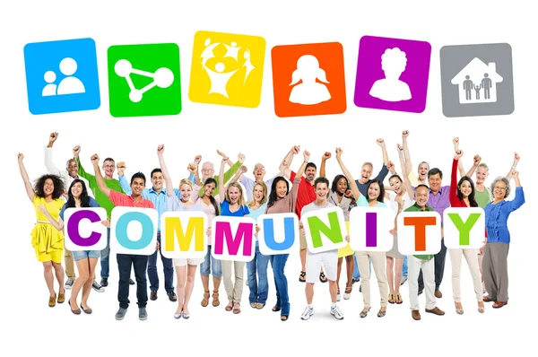 Lidé drží lepenky slovo Společenství — Stock fotografie