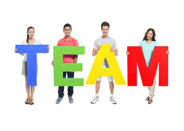 People Holding word 'team' — Stockfoto