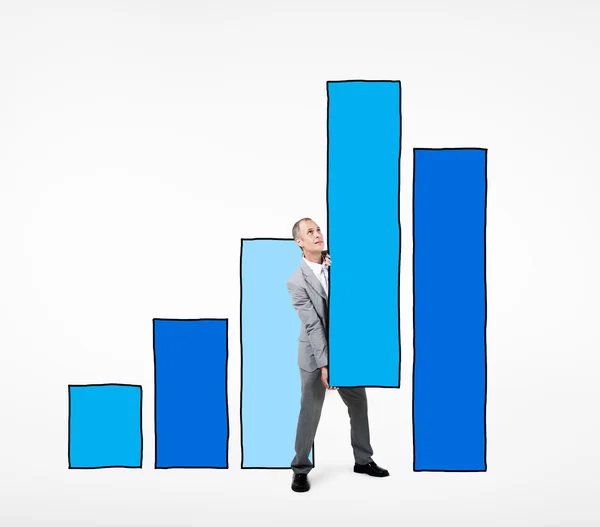 Businessman Supporting Bar Graph — Stock Photo, Image