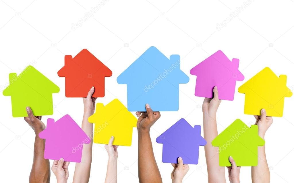 Hands holding icon houses