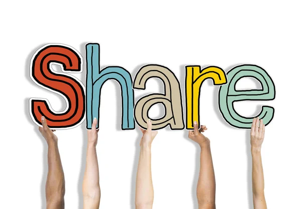Manos sosteniendo la palabra Compartir —  Fotos de Stock