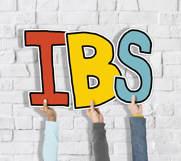 Hands holding IBS letters — Stock Photo, Image
