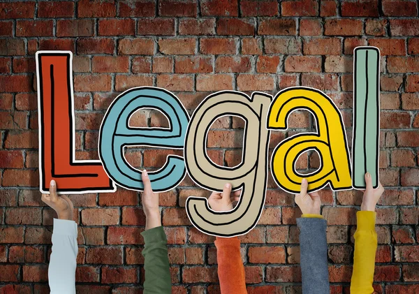 Hands holding word 'Legal' — Stockfoto