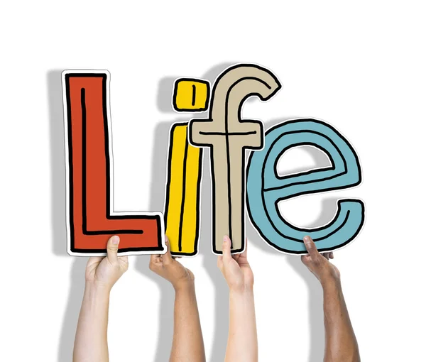 Hands holding word 'life' — Stockfoto