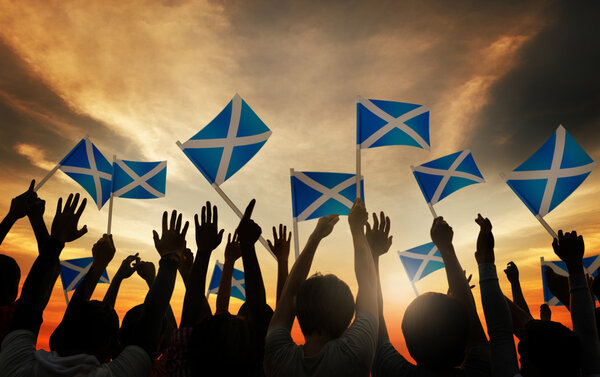 People Waving Scottish Flags