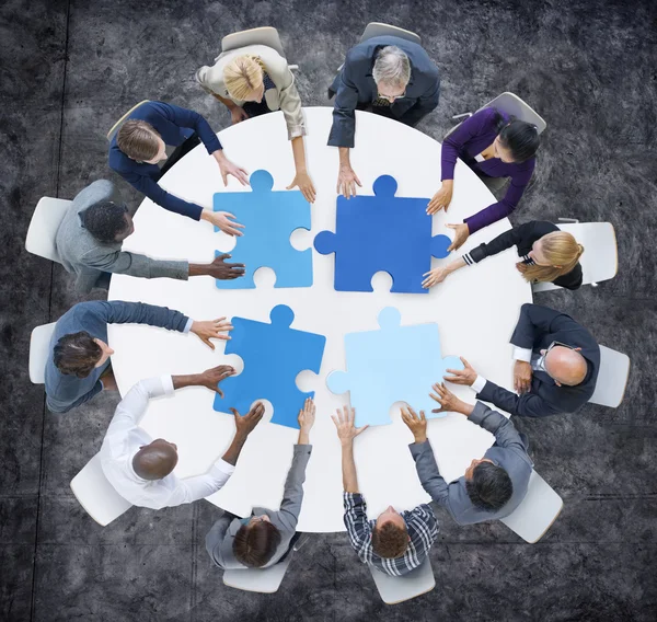 Business People and Jigsaw Puzzle Pieces — Stock Photo, Image