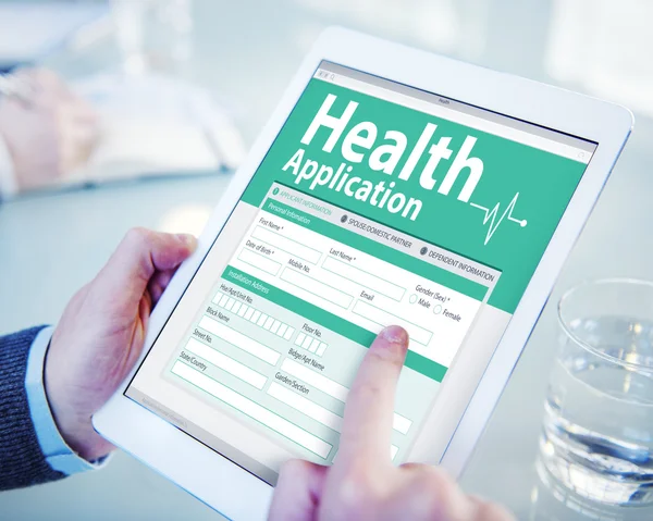 Man holding tablet with Health Insurance — Stock Photo, Image