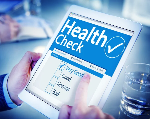 Man holding tablet with Health Check — Stock Photo, Image