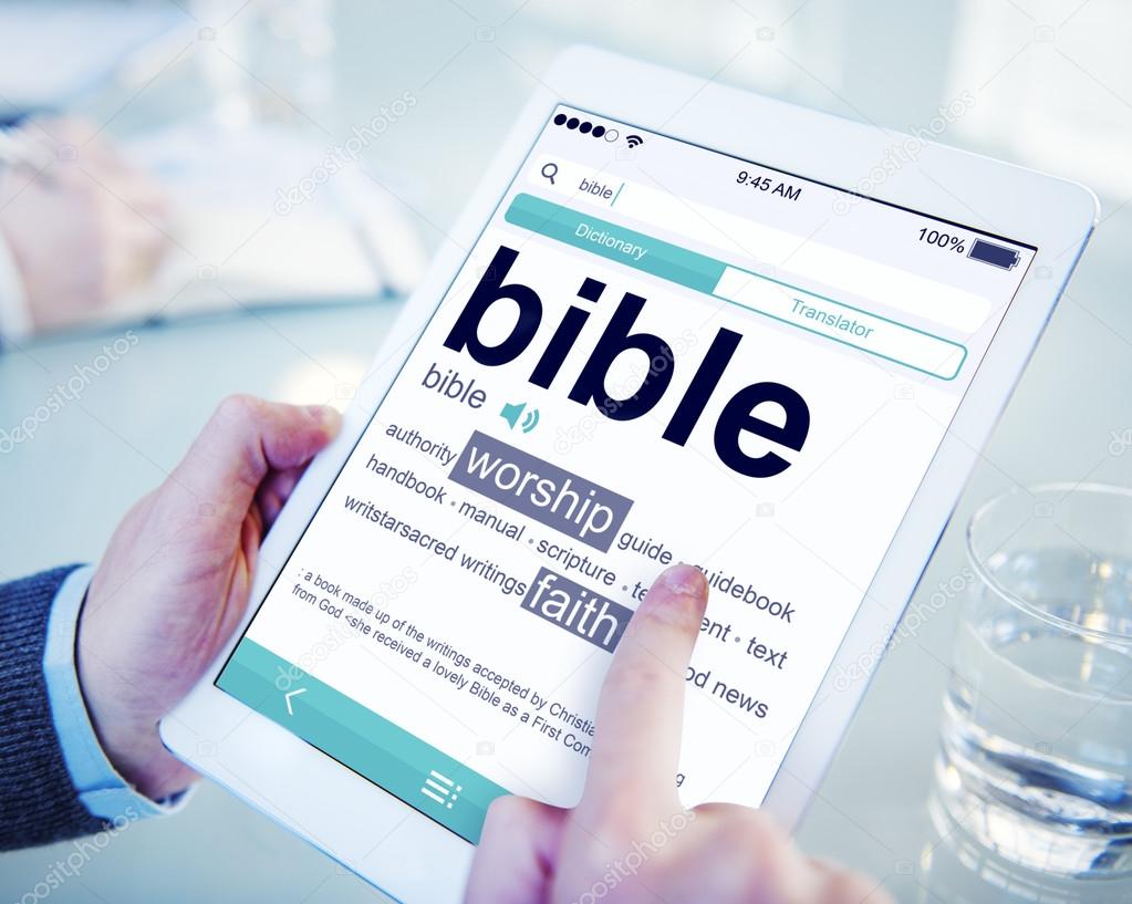 Man Reading the Definition of Bible