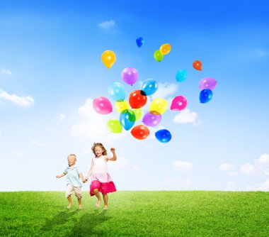 Girl and Boy Holding Balloons clipart
