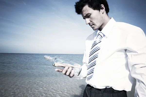 Businessman holding bottle — Stock Photo, Image