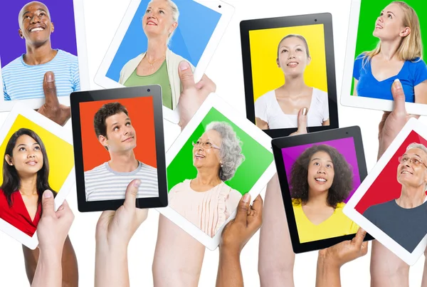 Tablets with people portraits — Stock Photo, Image