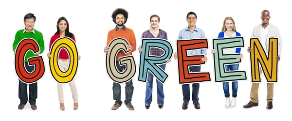 Groep mensen houden ga groene tekst — Stockfoto