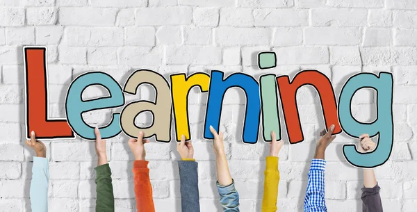 Group of Hands Holding Learning Word — Stock Photo, Image