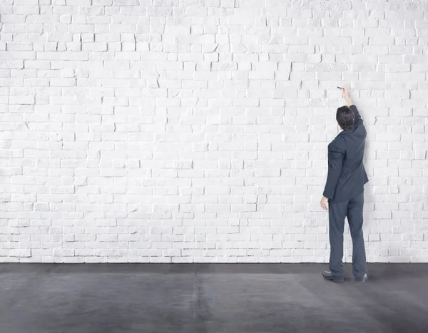 Businessman writes on Wall — Stock Photo, Image