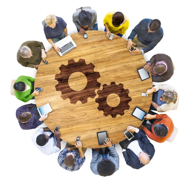 People around table with Gear Concept — Stock Photo, Image