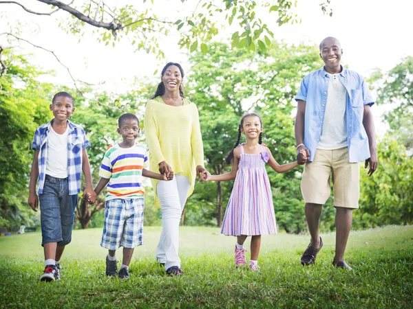 African American family relaxes on the nature Stock Photo