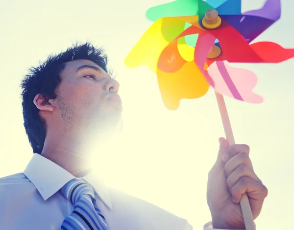 Businessman Blowing a fun — Stock Photo, Image