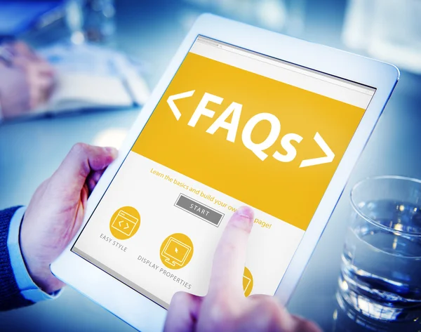 Hands holding tablet with FAQs — Stock Photo, Image