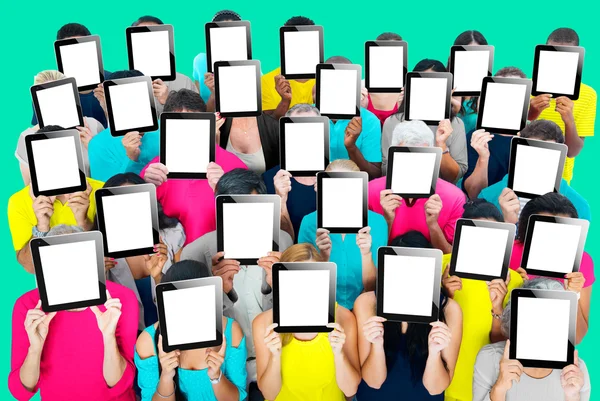 People with Digital Tablets pc covering their faces — Stock Photo, Image