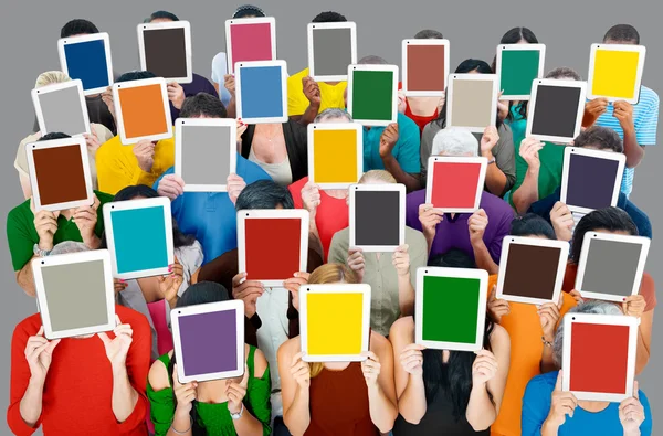 People with Digital Tablets pc covering their faces — Stock Photo, Image