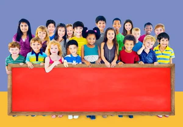 Group of Multiethnic children with blackboard — Stock Photo, Image