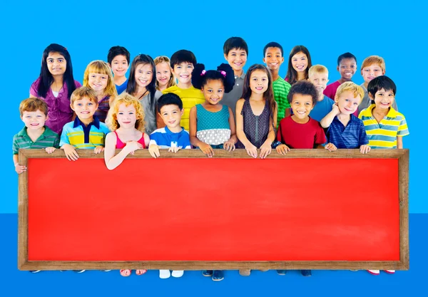 Group of Multiethnic children with blackboard — Stock Photo, Image