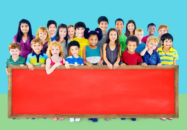 Group of Multiethnic children with blackboard — Stock Photo, Image