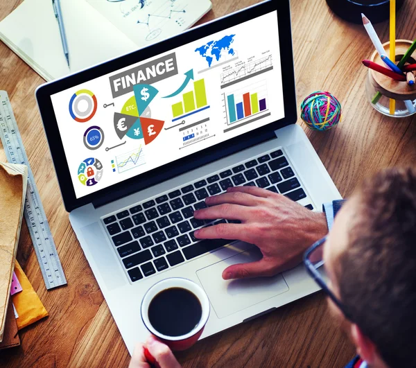 Man using laptop and Finance bar graphs — Stock Photo, Image