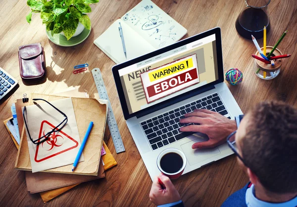 Man using laptop with Ebola Concept — Stock Photo, Image