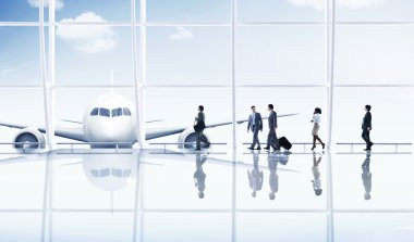 Business People traveling in Airport clipart