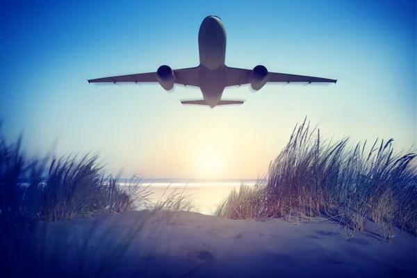 Airplane above seashore — Stock Photo, Image