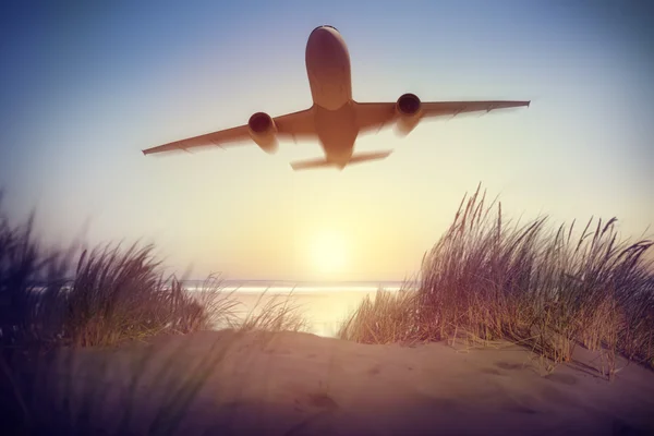 Airplane above seashore — Stock Photo, Image