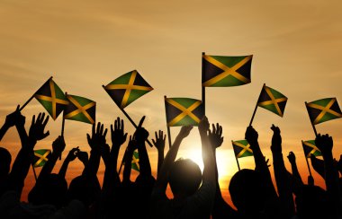 Group of People Waving Jamaica Flags clipart